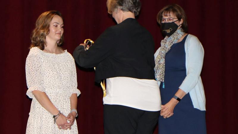 Molly Weatherill being pinned by her mother, Stephanie Weatherill