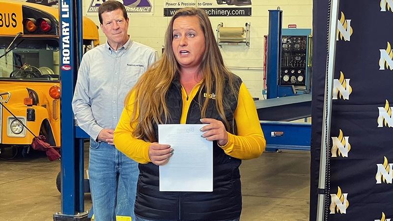 Jennifer Wagner from Big Iron Auctions presents the Cal West Memorial Scholarship at the Applied Technology Campus Expansion Open House event.