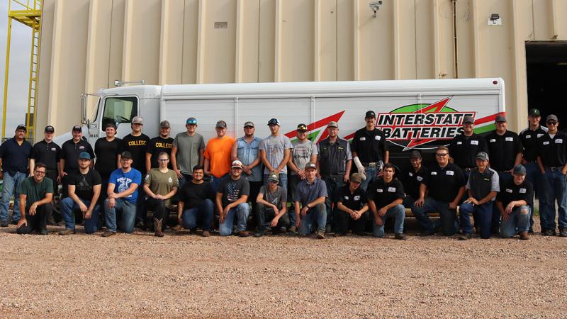 Northeastern Junior College Diesel Technology students post for a photo with representatives from Interstate Batteries of the Rockies.
