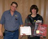 Layton Peterman, (left) professor of automotive technical at NJC and coordinator of the USA Skills District III competition presents Collin Brungardt of Sterling (right) with the second place award. 