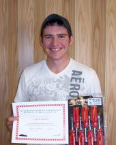 Taylor Kokes displays his prizes for having the top written score during the recent Skills USA Automotive Competition held on NJCâ s campus. 