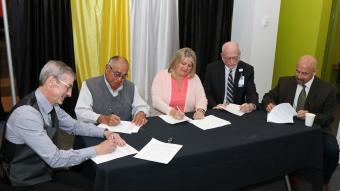 cal and state organizations come together to sign a pledge to support the advancement in diversity and inclusion within the work place.