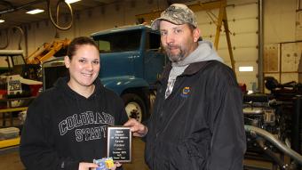Laura Fincher of Sterling (left), the NAPA Student of the Month for October 2013, receives her award from Aaron Hettinger, the outside sales manager for NAPA.