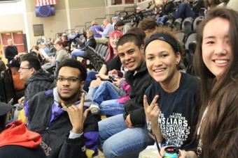 students in the gym smiling